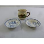 An Arts and Crafts milk jug and two blue and white dishes
