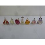 Seven Royal Doulton figurines to include, Fair Lady (over signed in gold 1988), Kirsty (over