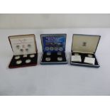 Two four coin £1 proof silver coin sets 1984-1987 and 2003 and a two coin set 2000 and 2003