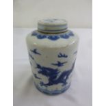 A Chinese Kangxi blue and white ginger jar and cover, decorated with dragons and bats, marks to