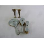 A silver and enamel three piece dressing table set and a pair of silver bud vases