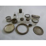 A quantity of silver and white metal to include a circular photograph frame, coasters, napkin rings,