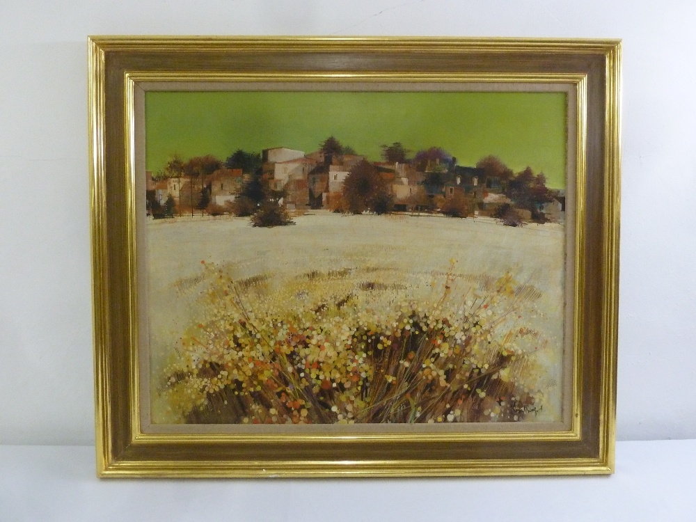 A framed oil on canvas of houses behind a field of flowers, signed bottom right, 63 x 79.5cm