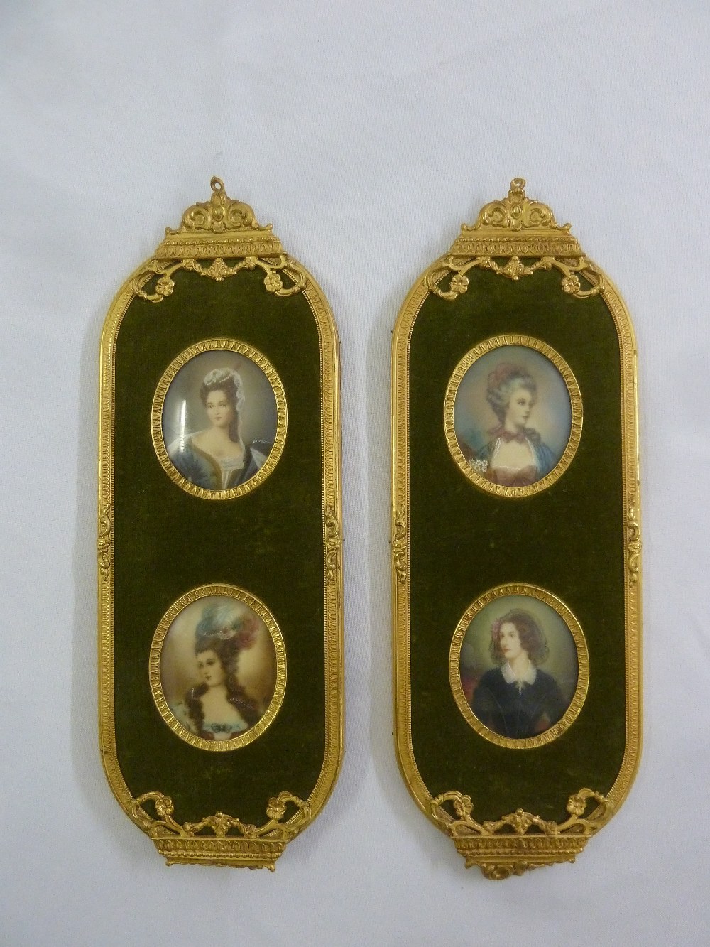 A pair of gilded metal framed miniatures of ladies in 18th century costume