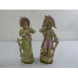 A pair of French bisque figurines in 18th century costume