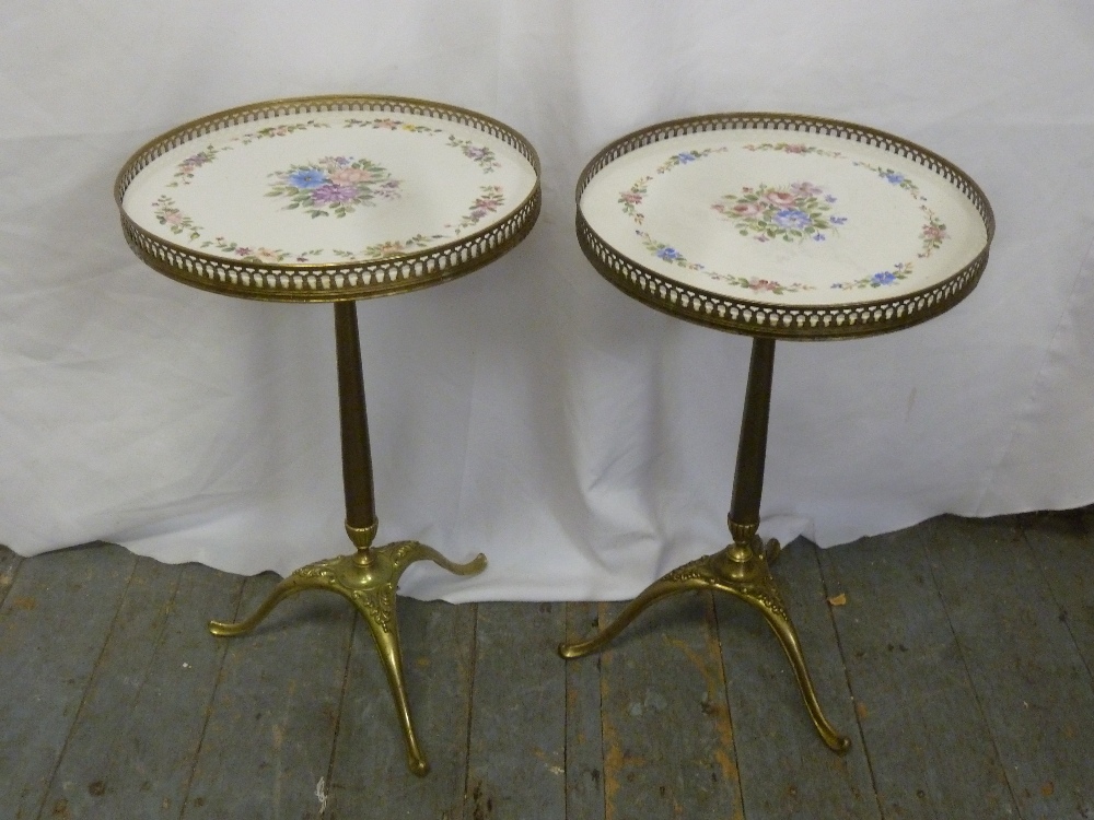 A pair of brass gallery side tables on triform bases