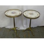 A pair of brass gallery side tables on triform bases