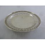 A white metal fruit dish circular with scroll pierced sides on raised circular base stamped