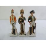 Three porcelain military figurines in 19th century dress