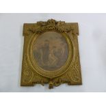 A 19th century framed and glazed polychromatic oval print in ornate rectangular frame