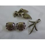 A pair of antique silver and coloured stone earrings and two marcasite brooches