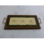 A rectangular Edwardian inlaid wooden tea tray inset with three ceramic tiles