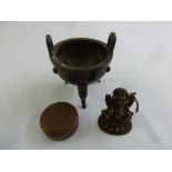 A Chinese circular brass jewellery box with pull off cover, a bronze incense burner and a bronze