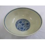 A Chinese Qianlong blue and white bowl decorated with flowers and leaves