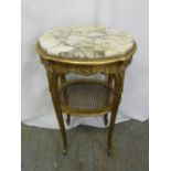 A French oval gilded wood and marble side table on four cabriole legs