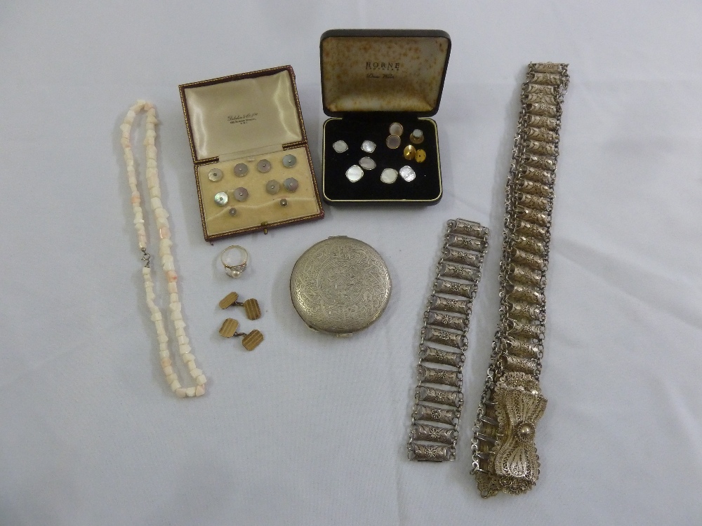 A quantity of costume jewellery to include dress buttons in fitted cases, a necklace, a metal belt