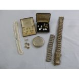 A quantity of costume jewellery to include dress buttons in fitted cases, a necklace, a metal belt