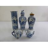 A quantity of Oriental blue and white ceramics to include two teapots and two baluster vases (5)