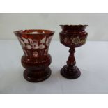 A Bohemian etched ruby glass vase and another glass vase decorated with flowers