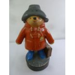 A plastic painted model of Paddington Bear used as a shop display charity box