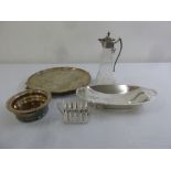 A quantity of silver plate to include a claret jug, a salver and a toast rack