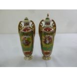 A pair of continental covered vases with pierced scroll side handles, marks to the base, A/F