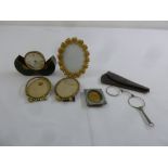 A quantity of collectables to include a travelling alarm clock, a micro mosaic frame and a pair of