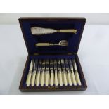 A cased set of silver plated fish eaters and servers