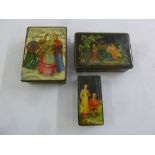 Three Russian lacquered boxes decorated with figures in various landscapes