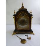 A late 19th century English Boulle chiming bracket clock, the arched top supporting vase form