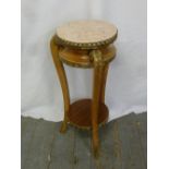 A French style circular side table on three legs with gilt metal mounts and pink marble inset top