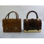 Two ladies snakeskin vintage handbags with metal clasps and loop handles