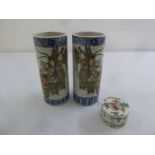 A pair of Oriental cylindrical vases decorated with figures and a Cantonese circular box and cover