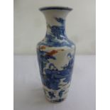 A Chinese late 19th century vase decorated with scenes of courtiers and family scenes