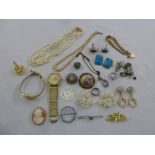 A quantity of costume jewellery to include necklaces, brooches, earrings and watches