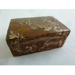 An Oriental rectangular tortoiseshell and gold overlay table snuff box in a hinged protective