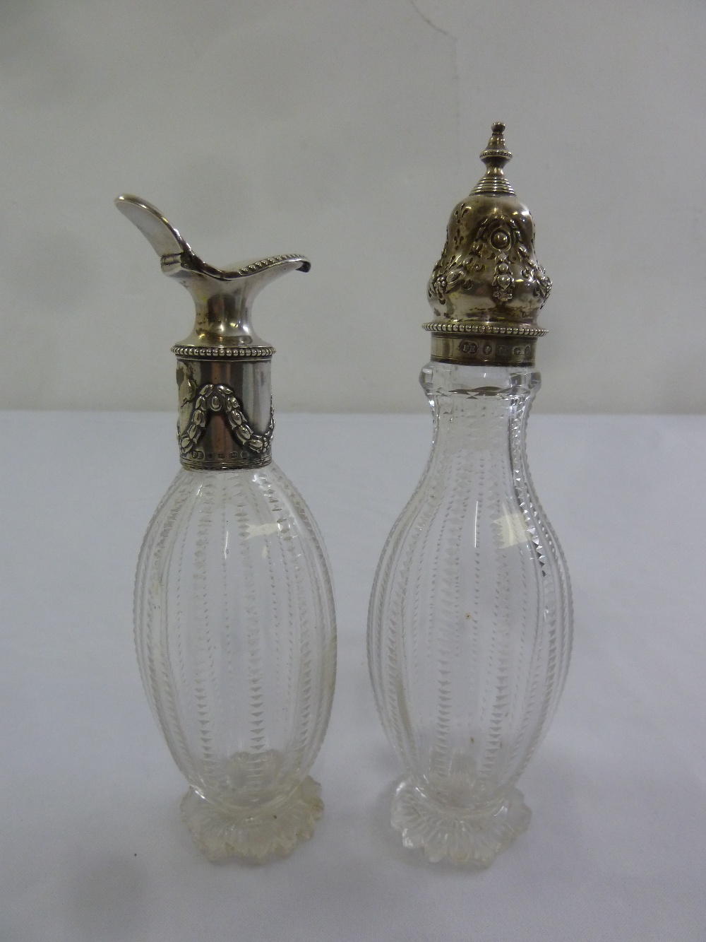 Victorian sugar sifter with silver pull off cover and a matching cruet bottle