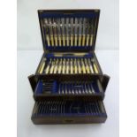 A canteen of silver plated Old English pattern flatware in fitted mahogany chest for twelve place