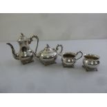 Silver plated four piece teaset of bellied circular form on four scroll feet