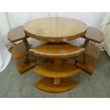 An Art Deco style circular coffee table with four detachable side tables