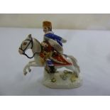 A Meissen figurine of a Hussar on horseback, marks to the base