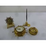 A quantity of brass nautical items to include a wall clock, a desk clock in the form of a ships