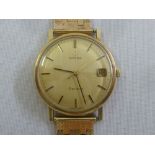 Omega Geneve 9ct gold gentlemans wristwatch on a 9ct gold articulated bracelet, approx total