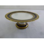 A Vienna cake stand blue and gilded border on raised circular base