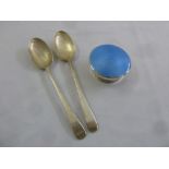 A pair of silver table spoons and a silver and enamel dressing table jar cover