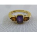 18ct yellow gold amethyst and citrine three stone ring stamped Garrard, approx total weight 4.8g