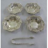 Four silver bonbon dishes and a pair of sugar tongs