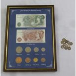 A framed and glazed GB coin and bank note decimal currency display and ten silver threepences