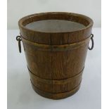 An Edwardian oak planter with brass mounts and side handles
