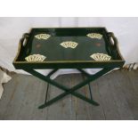 A rectangular lacquered tray on stand decorated with playing cards